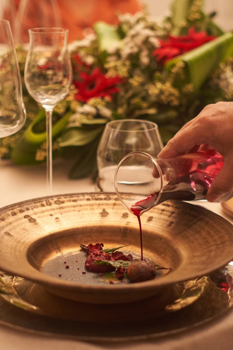 A course from La VidA's tasting menu, wine reduction poured tableside at Susana Balbo Winemaker's House